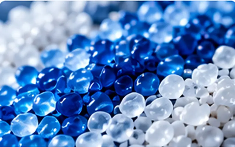 Close-up of blue and white polymer resin pellets